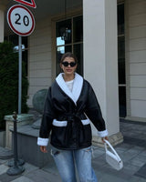Manteau ceinturé cuir effet mouton oversize