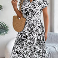 Robe fleurie ceinturée plissée midi