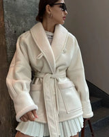 Manteau ceinturé cuir effet mouton oversize