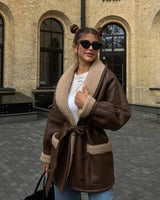 Manteau ceinturé cuir effet mouton oversize